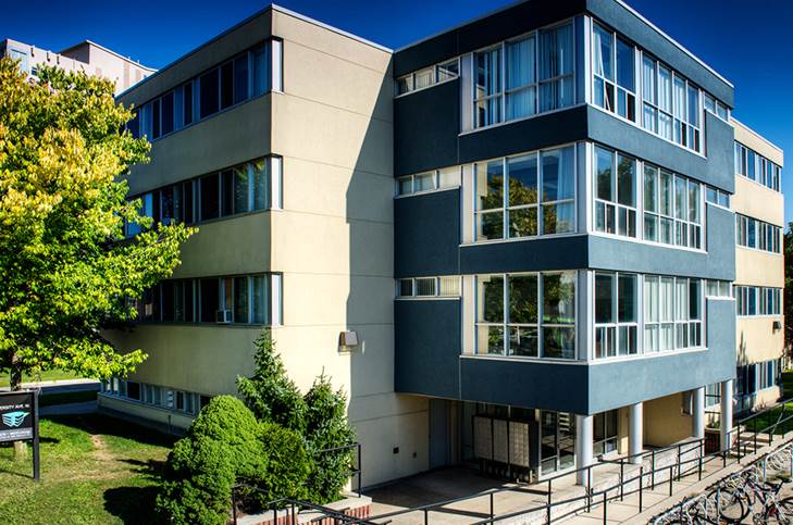 A four storey building with large windows, the former student dorm was used as the site for University Avenue housing.