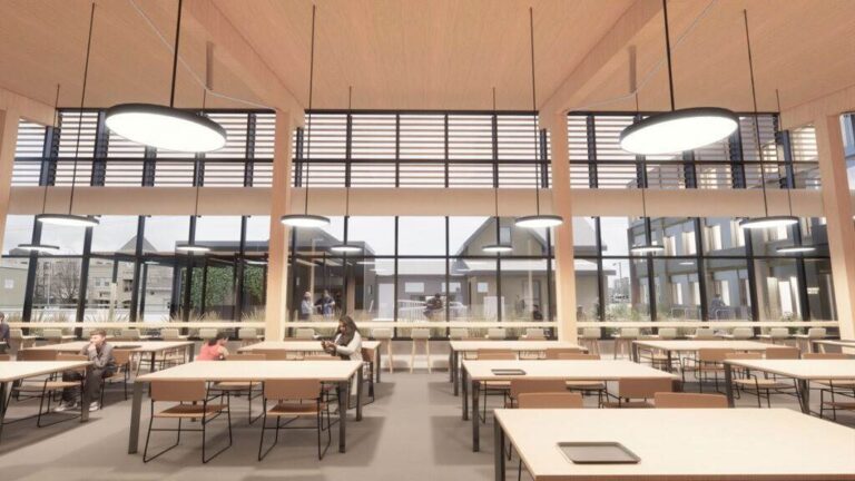 A computer generated image of the proposed new Saint John Kitchen community space with full window exterior wall, wood beams, tables and chairs