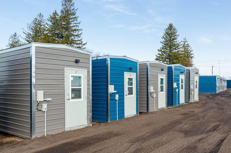 A row of housing cabins at the Erbs Road Shelter site